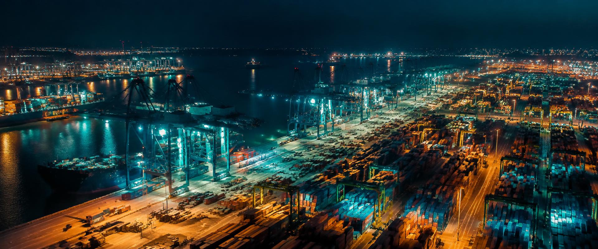 Container terminal at night with gantry cranes
